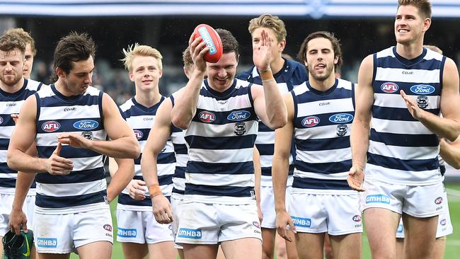 Patrick Dangerfield leads Geelong off after beating Richmond.