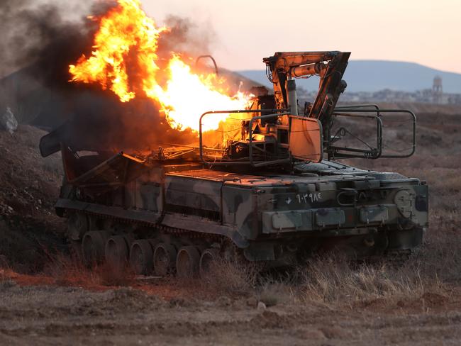 Air defence radar burns at Mezzeh Air Base in Damascus, Syria. Picture: Getty Images