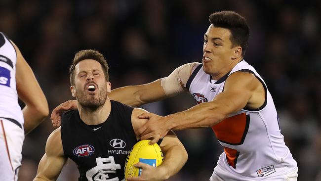 Carlton's Matthew Wright gets taken high by GWS Giants Dylan Shiel . Pic: Michael Klein