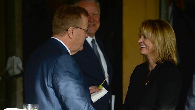 AOC president John Coates shakes hands with challenger Danni Roche on Saturday.