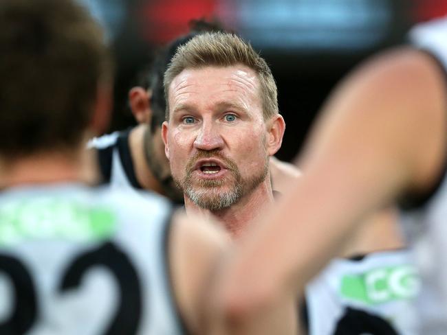 BRISBANE, AUSTRALIA - AUGUST 30: Magpies coach Nathan Buckley talks to his team during the round 14 AFL match between the Carlton Blues and the Collingwood Magpies at The Gabba on August 30, 2020 in Brisbane, Australia. (Photo by Jono Searle/AFL Photos/via Getty Images)