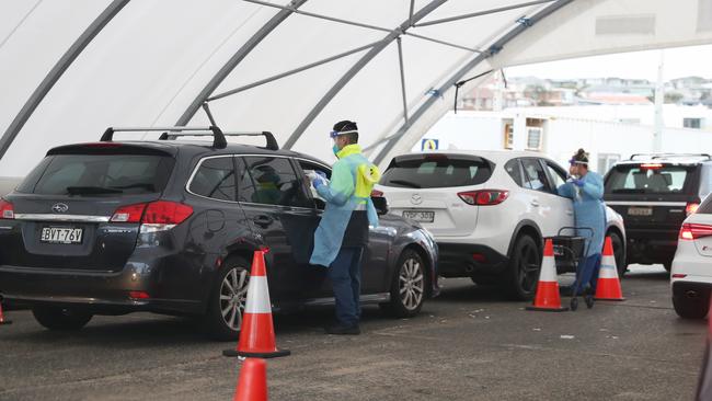 Inside the busy Covid testing tent at Bondi Beach. Picture John Grainger