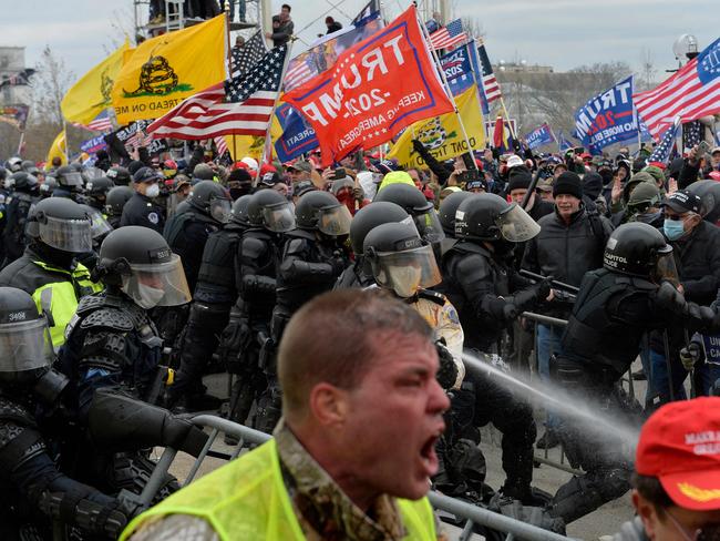 Trump supporters clash with police and security forces as people try to storm the US Capitol in Washington DC on January 6. Picture: AFP