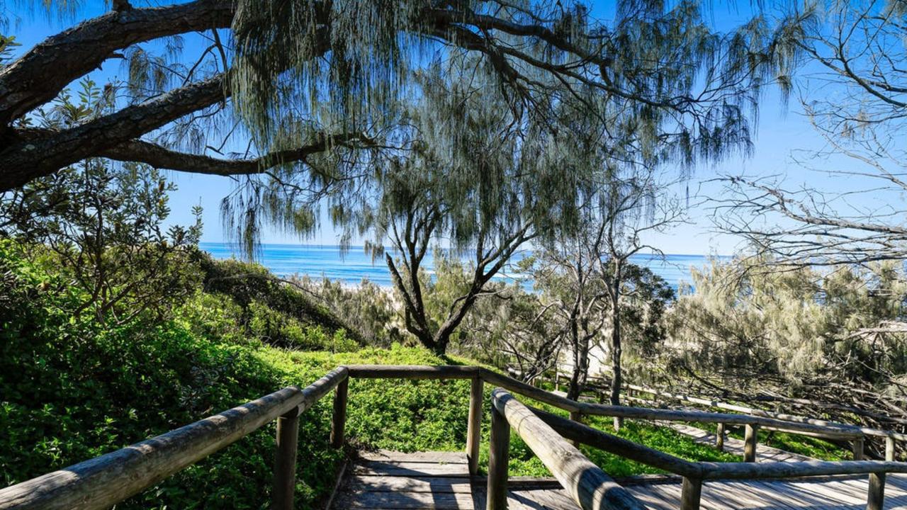 The property uses a walkway down to the beach.