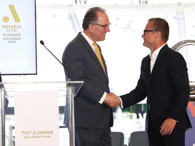 NSW Sport Minister Alister Henskens (left) and A-League boss Danny Townsend shake hands after committing to the deal for grand finals to be played in Sydney. Picture: Mark Kolbe / Getty Images for APL