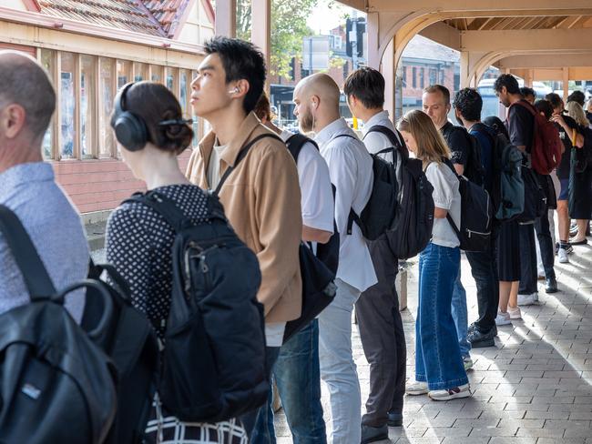 Commuters waiting at Watson St bus stop in Neutral Bay on Wednesday morning. Picture /Thomas Lisson