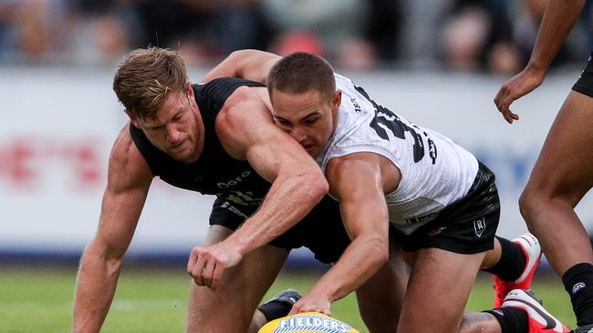 Boyd Woodcock (right) fighting for the ball with Port captain Tom Jonas during the club’s internal trial last month. Picture: Matt Turner/AFL Photos via Getty Images