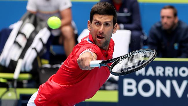 Novak Djokovic stretches to hit a return against Denis Shapovalov during the ATP Cup on Tuesday Picture: AFP