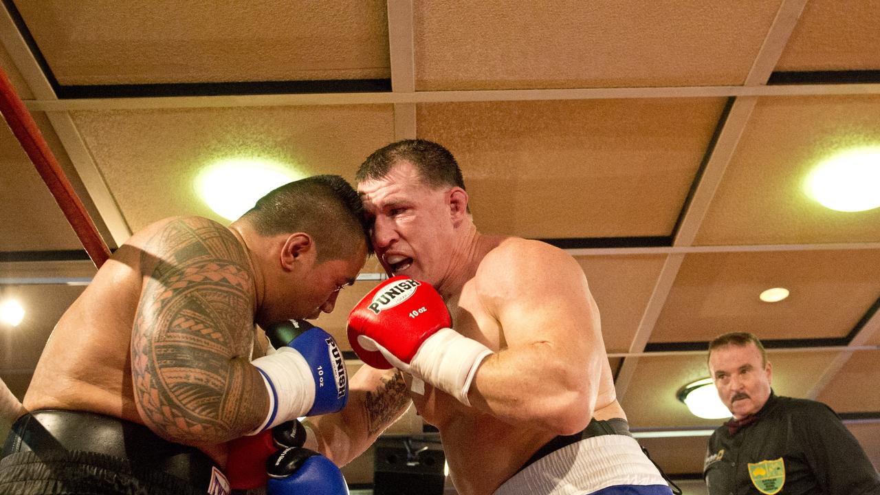 Paul Gallen and Herman Ene-Purcell fight it out in Toowoomba. Friday, Jan 29, 2016.