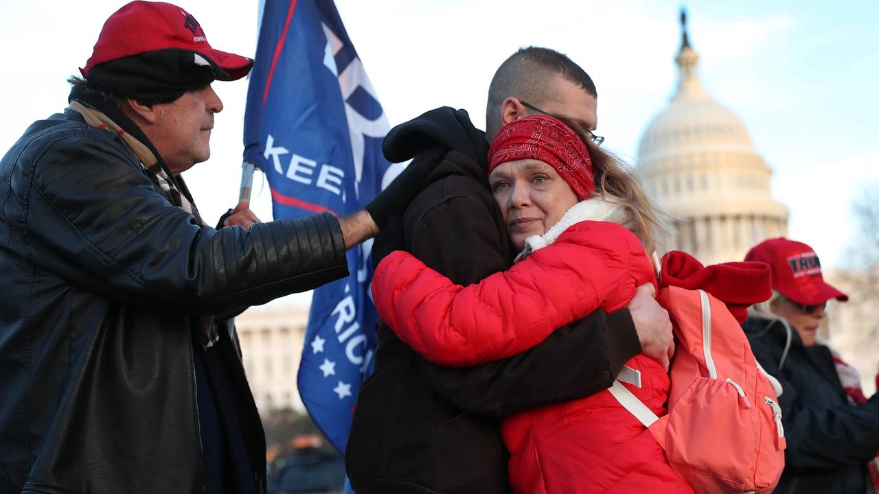 Fellow Trump supporters visit a memorial for Ms Babbitt near the Capitol, the day after she was killed. Picture: Joe Raedle/Getty Images/AFP