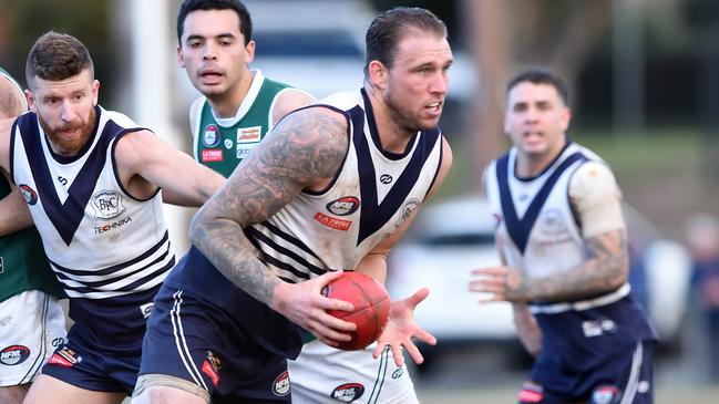 NFL Football: Bundoora v Greensborough, ruckman Hamish Shepheard looks to dispose of the ball. Picture: Steve Tanner