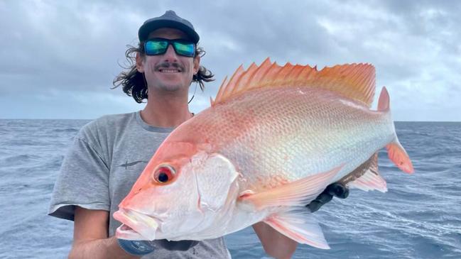 Karl Bruanto shows one of several quality large mouth nannygai he caught recently fishing with Cairns charter boat The Sheriff. Picture: Robert Erskine