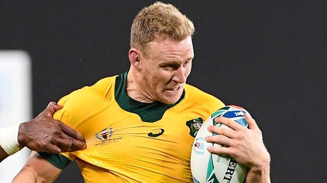 Australia's wing Reece Hodge is tackled during the Japan 2019 Rugby World Cup Pool D match between Australia and Fiji at the Sapporo Dome in Sapporo on September 21, 2019. (Photo by WILLIAM WEST / AFP)