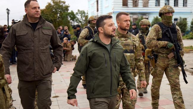 Ukrainian President Volodymyr Zelensky walking during his visit to the de-occupied city of Izyum, Kharkiv region.