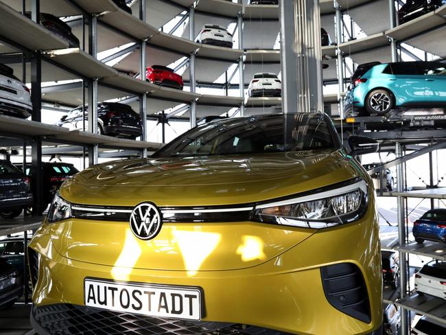 A Volkswagen ID.4 electric Sport Utility Vehicle (SUV) inside the Volkswagen AG (VW) Autostadt automobile delivery towers, at the automaker's plant in Wolfsburg, Germany, on Friday, March 26, 2021. Volkswagen's stock started taking off last week as investors bought into the Germany company’s plan to supplant Tesla Inc. as the global leader in electric cars. Photographer: Liesa Johannssen-Koppitz/Bloomberg