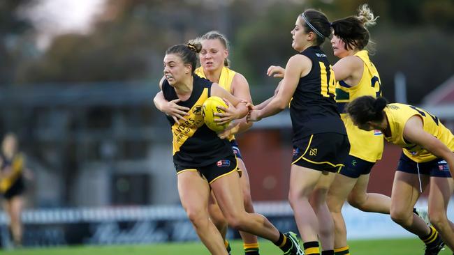 Ebony Marinoff tries to break away from a tackle while playing for Glenelg against Woodville-West Torrens in the SANFLW. She is the competition’s Player of the Week for round 10. Picture: Cory Sutton