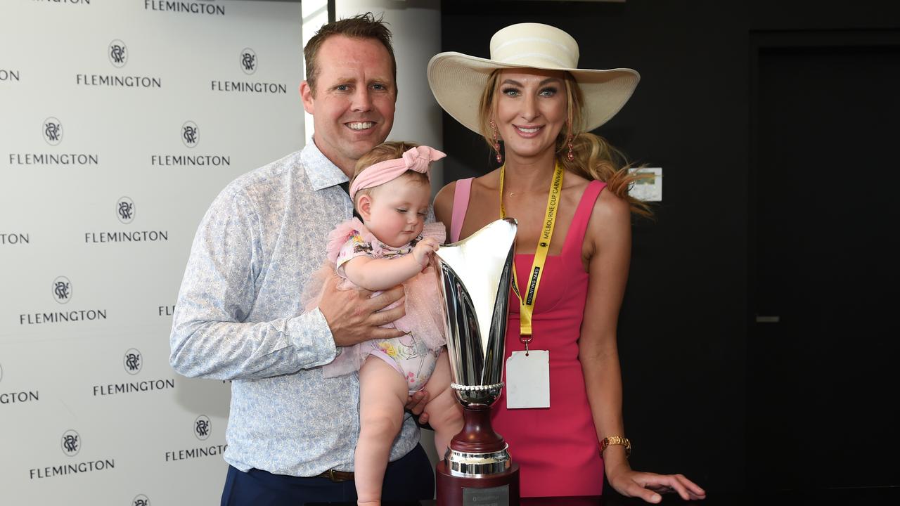 Travis Doudle and wife Emmah with daughter Willow, celebrate a win at Flemington in 2023. Picture: Racing Photos via Getty Images