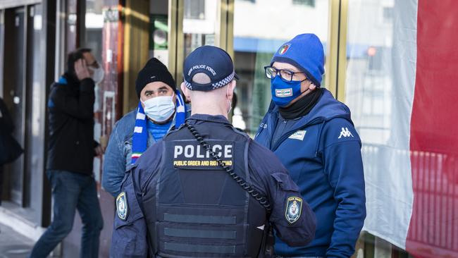 Police speaking to Italian fans in Leichhardt.