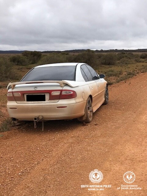 The man’s white Holden on the side of the road at Ucolta. Picture: SAPOL