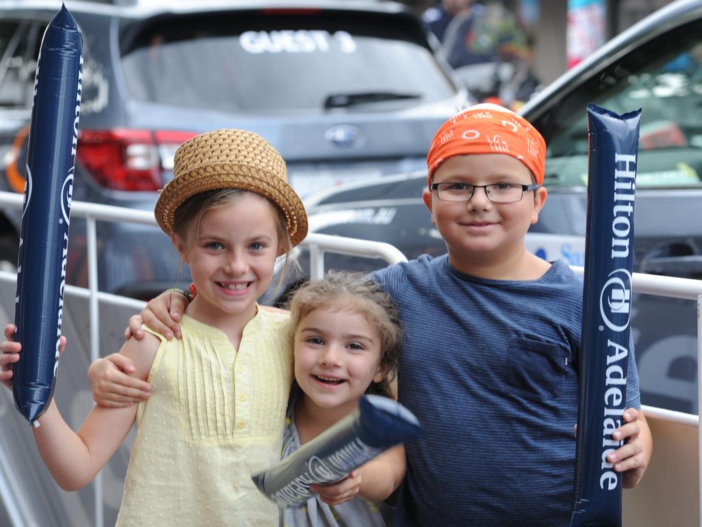 Molly, Lecisa and Marcus from Adelaide get ready to make some noise. Picture: Tricia Watkinson