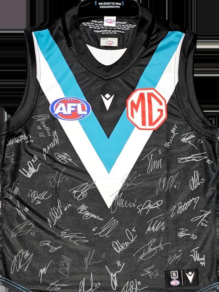 This signed Port Adelaide guernsey and a scarf are up for grabs.