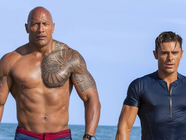 This image released by Paramount Pictures shows Dwayne Johnson as Mitch Buchannon, left, and Zac Efron as Matt Brody in "Baywatch." (Frank Masi/Paramount Pictures via AP)