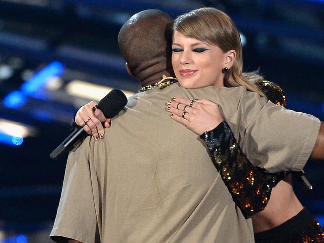 Happier times: Kanye West accepts an award from Taylor Swift during the 2015 MTV Video Music Awards.