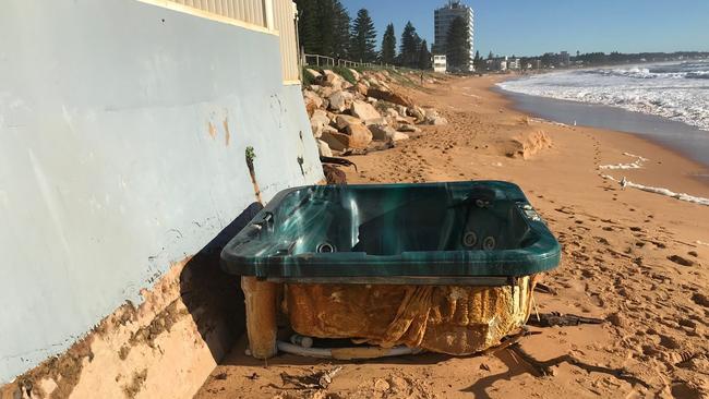 A fibreglass jacuzzi that washed up on Collaroy Beach was removed by a council clean-up crew. Picture: Northern Beaches Council