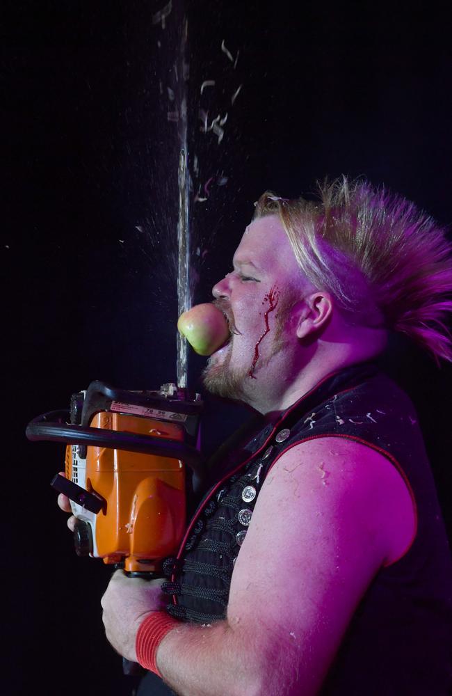 BEST PHOTOGRAPHS 2022. Evan Morgan. Part of the World's Greatest Freakshow, the Great Gordo Gamsby reclaims the world record for cutting the number of apples held in his mouth in a minute to 30 at the Ville. Picture: Evan Morgan