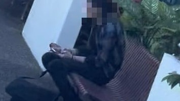 The defendant took a moment to recover outside Gympie Court before her matter reconvened.