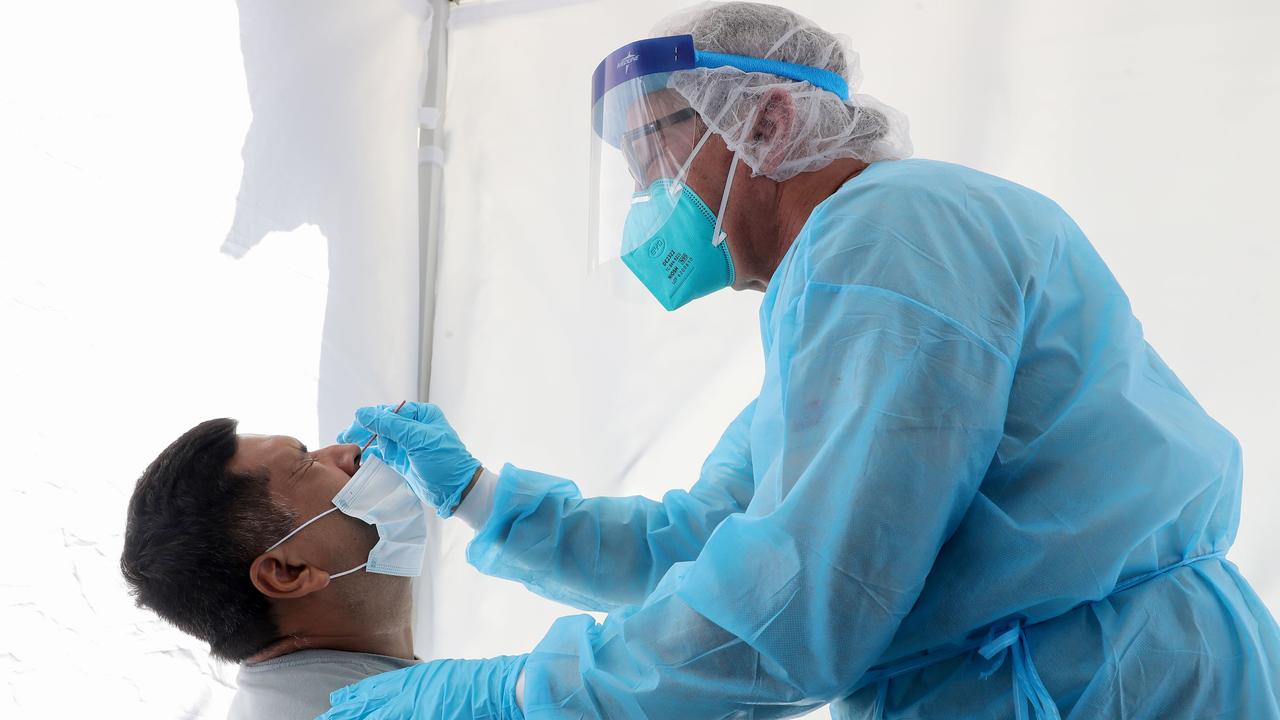 A doctor treats a patient in Los Angeles. Picture: Mario Tama/Getty Images/AFP