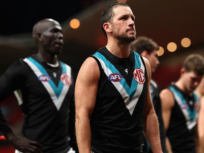 SYDNEY, AUSTRALIA - JUNE 16: Travis Boak of the Power and team mates look dejected after losing the round 14 AFL match between Greater Western Sydney Giants and Port Adelaide Power at ENGIE Stadium, on June 16, 2024, in Sydney, Australia. (Photo by Cameron Spencer/Getty Images)