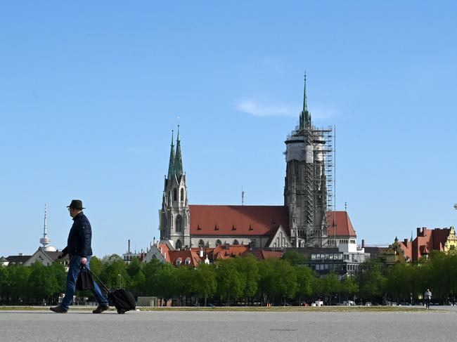 A man walks at the empty Theresienwiese, the lcation for the Oktoberfest beer festival in Munich. Picture: AFP.