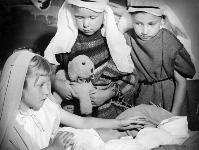 Pauline Carboon, Richard Lowery and John Shinkfield perform a nativity scene at their Prahran kindergarten in 1955.