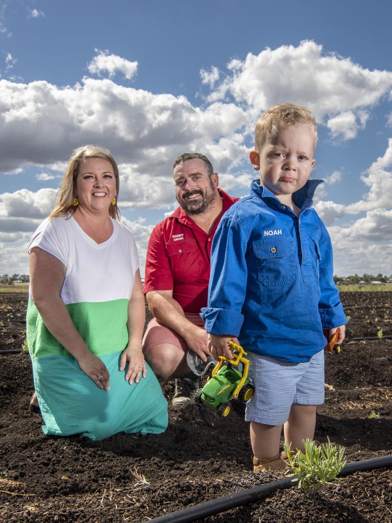 Alicia and Craig Vohland with their one-year-old son Noah at Windy Acres Farm, a Toowoomba lavender and honey farm in Westbrook. Picture: Nev Madsen