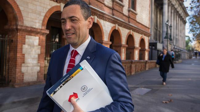 Treasurer Tom Koutsantonis walks to State Parliament with the State Budget. Picture: Ben Macmahon/AAP