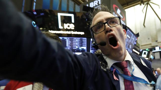 Trader Gregory Rowe works on the floor of the New York Stock Exchange, Tuesday, Oct. 23, 2018. Stocks are opening sharply lower on Wall Street following big drops in Asia and Europe. (AP Photo/Richard Drew)