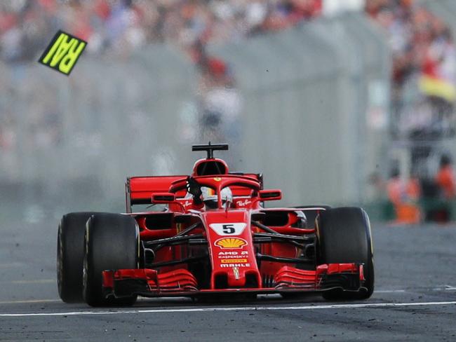 German driver Sebastian Vettel of Ferrari crosses the finish line to win the Formula 1 2018 Australian Grand Prix at the Albert Park Circuit in Melbourne, Sunday, March 25, 2018. (AAP Image/Dave Acree) NO ARCHIVING, EDITORIAL USE ONLY