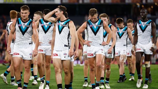 Port Adelaide players walk off the Gabba on Saturday night. Picture: Michael Willson/AFL Photos