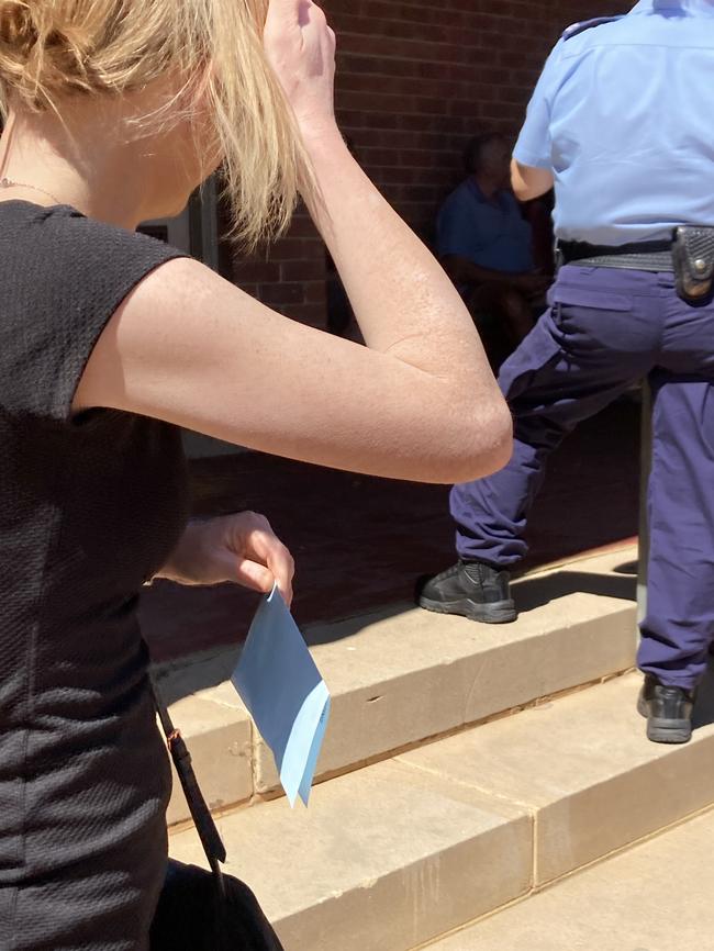 Morgan Shotton dodged cameras outside Wellington Local Court after pleading guilty to six fraud charges. Picture: Ryan Young