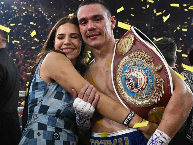 Tszyu and Alexandra celebrate following victory over Tony Harrison in 2023. Picture: Saeed KHAN / AFP