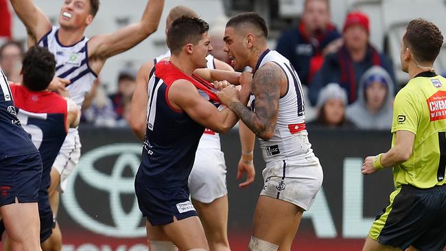 Michael Walters gets up close to Melbourne’s Jay Lockhart. Picture: Getty Images