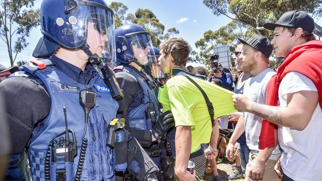 An anti-mosque protester shouts abuse across police lines. Picture: Jason Edwards