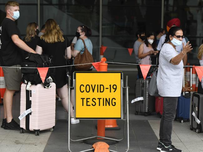 ADELAIDE, AUSTRALIA - NewsWire Photos FEBRUARY 11, 2021: AFL - Interstate travellers line up to get tested for COVID outside of Adelaide Airport.  Picture: NCA NewsWire / Naomi Jellicoe