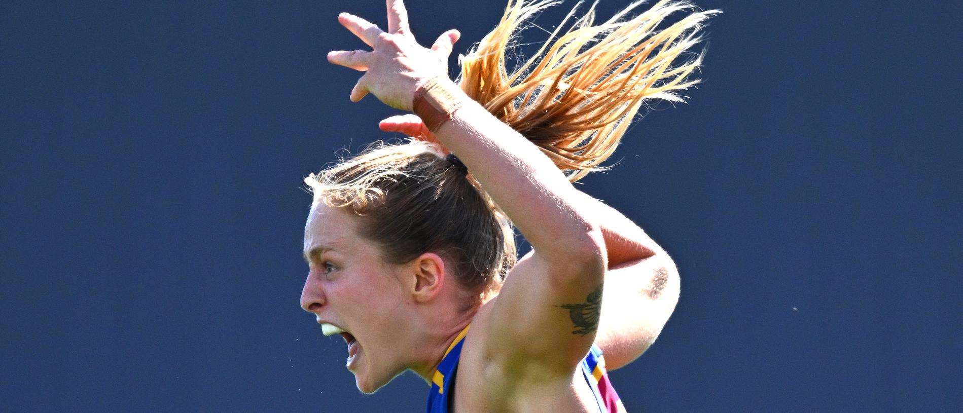 MELBOURNE, AUSTRALIA - DECEMBER 03: Dakota Davidson of the Lions is congratulated by Isabel Dawes after kicking a goal during the AFLW Grand Final match between North Melbourne Tasmania Kangaroos and Brisbane Lions at Ikon Park, on December 03, 2023, in Melbourne, Australia. (Photo by Quinn Rooney/Getty Images)