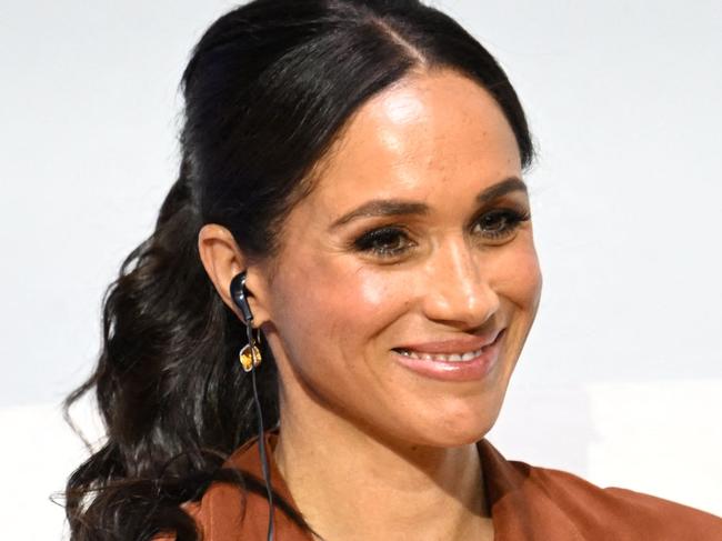 American actress Meghan Markle smiles during the 'Responsible Digital Future' forum in Bogota on August 15, 2024. Prince Harry and his wife, American actress Meghan Markle, arrived in Colombia at the invitation of Marquez, with whom they will attend various meetings with women and young people to reject discrimination and cyberbullying. (Photo by Raul ARBOLEDA / AFP)