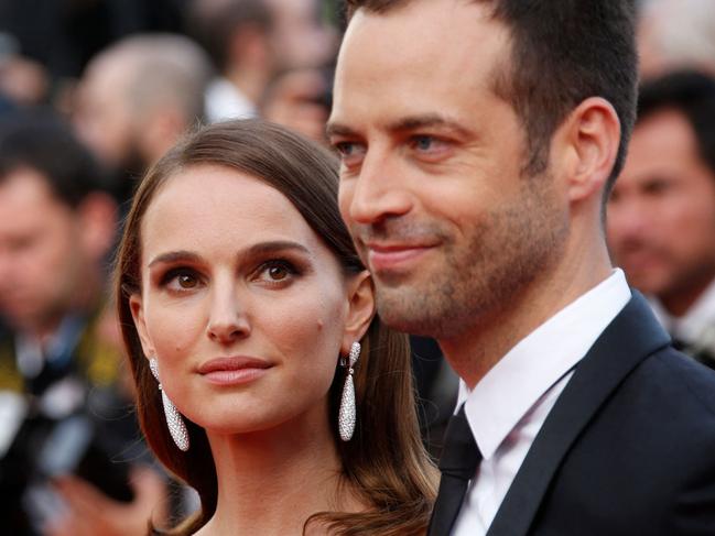 (FILES) US-Israeli actress and director Natalie Portman (L) and her husband French choreographer Benjamin Millepied pose as they arrive for the opening ceremony of the 68th Cannes Film Festival in Cannes, southeastern France, on May 13, 2015. Portman has divorced Millepied, US media reported on March 8, 2024. The "Black Swan" star filed last July to end her marriage of 11 years to Millepied, People magazine said. The divorce was finalized in France last month, it said, citing a Portman representative. (Photo by Valery HACHE / AFP)