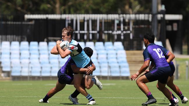 Jett Forbes is tackled by Ioane Lui in the SG Ball. Cronulla Sharks vs Melbourne Storm, Shark Park