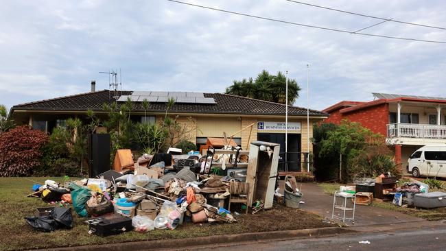A business on River St Cundletown, has items piled high in the street. Picture: NewsWire / Scott Calvin