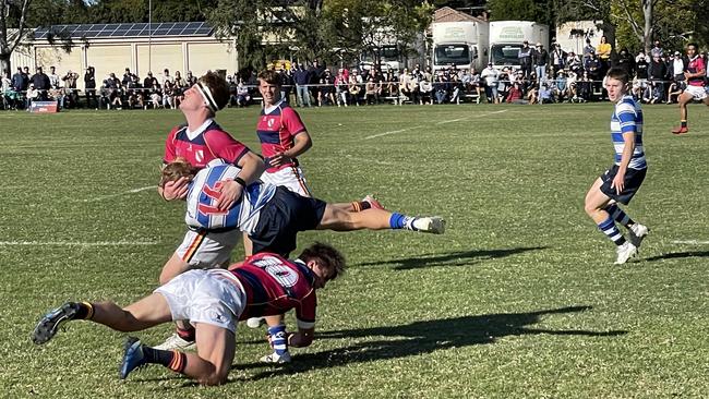 The Nudgee v BSHS was a willing contest, despite the scoreline. Here Boyd is tackled.